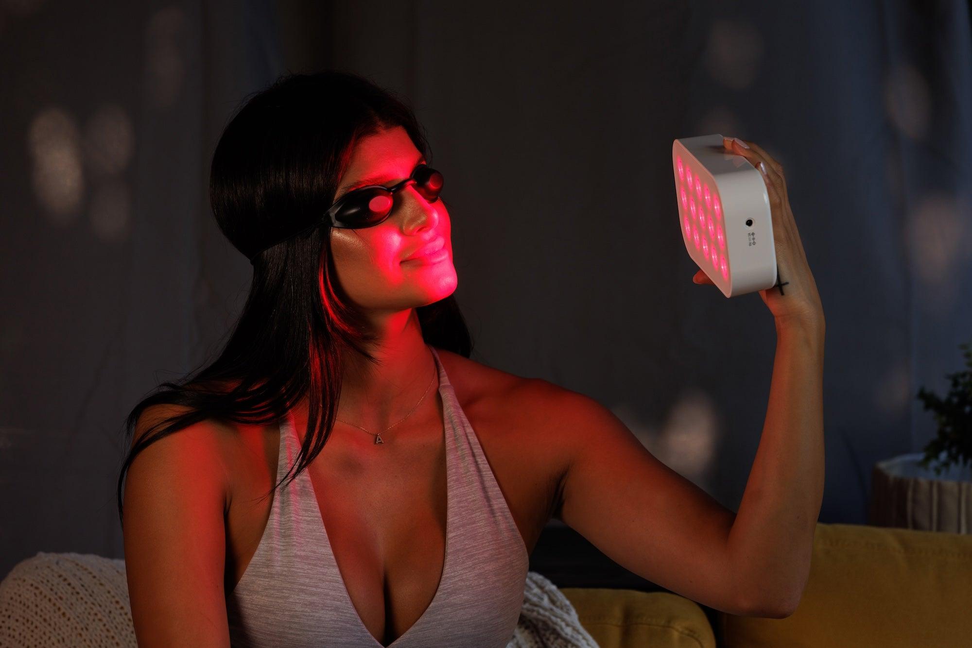 Important LumeBox safety precautions for red light therapy use, including eye protection and skin sensitivity
