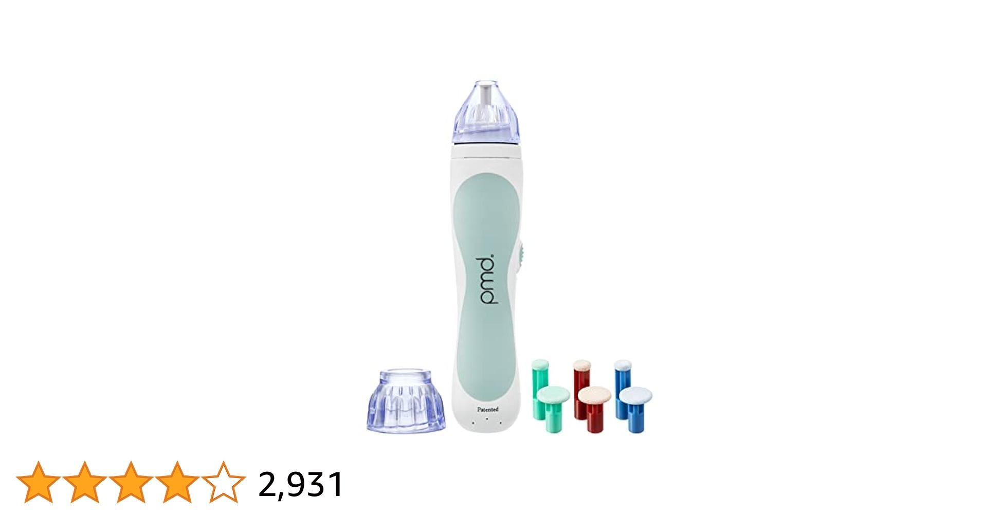 A person demonstrating the PMD Personal Microderm Classic on their face, highlighting the device's ergonomic design and suction function for at-home exfoliation.