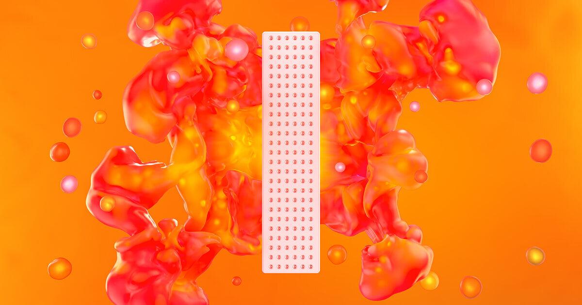 A person is shown using a red light therapy device, like The LumeBox or Joovv Mini, to target a specific area of their body for muscle recovery or skin health