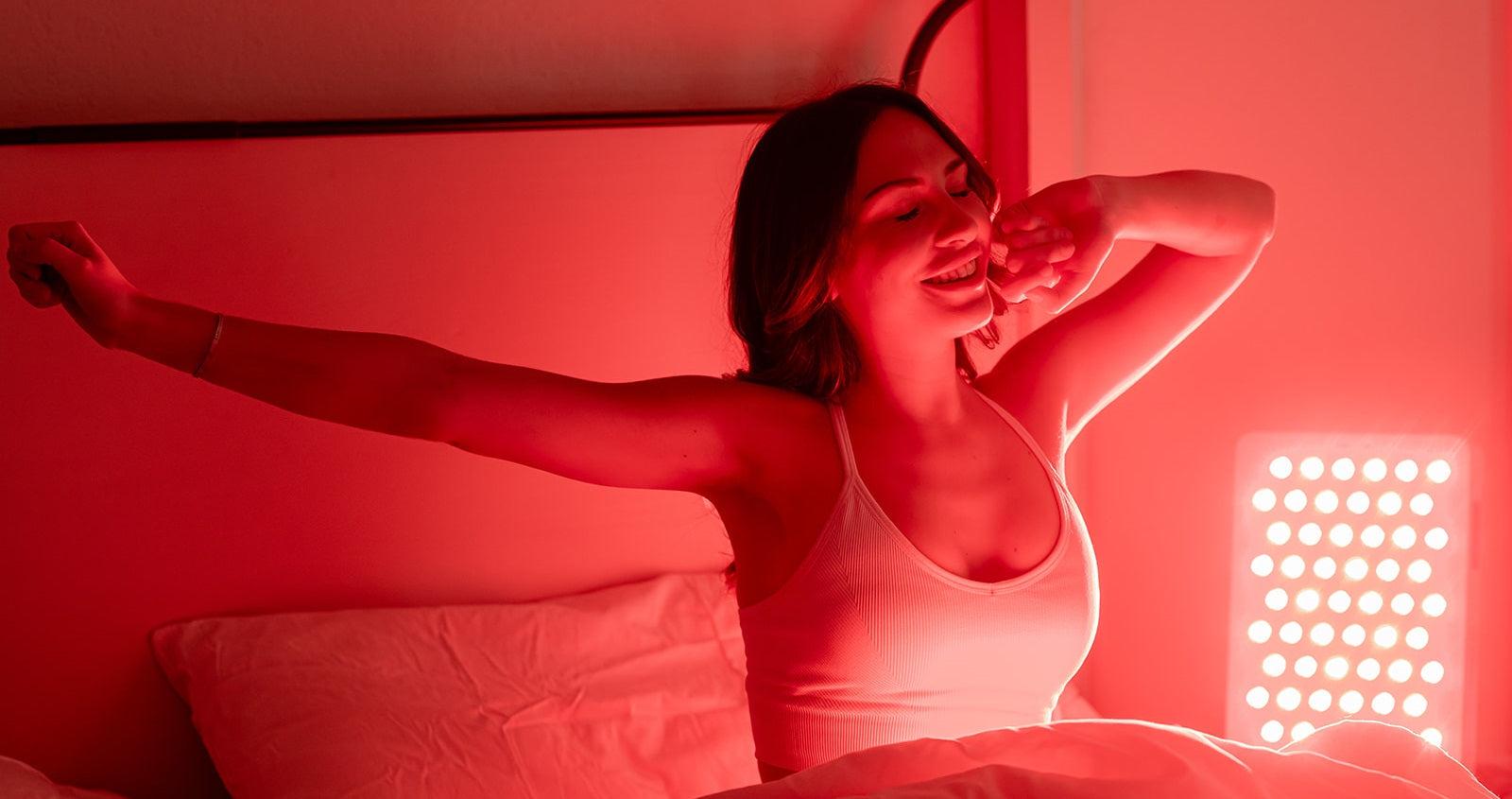 A person comfortably using an at-home red light therapy panel