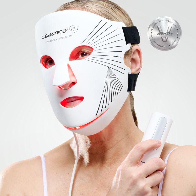 Woman using red light face mask consistently as part of her evening skincare routine for maximum benefit